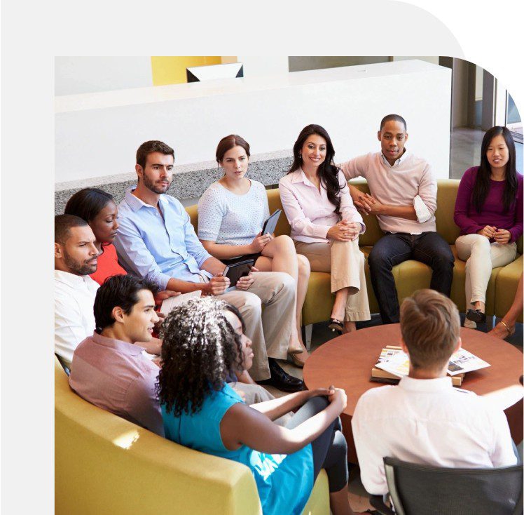 A group of people sitting around in a room.